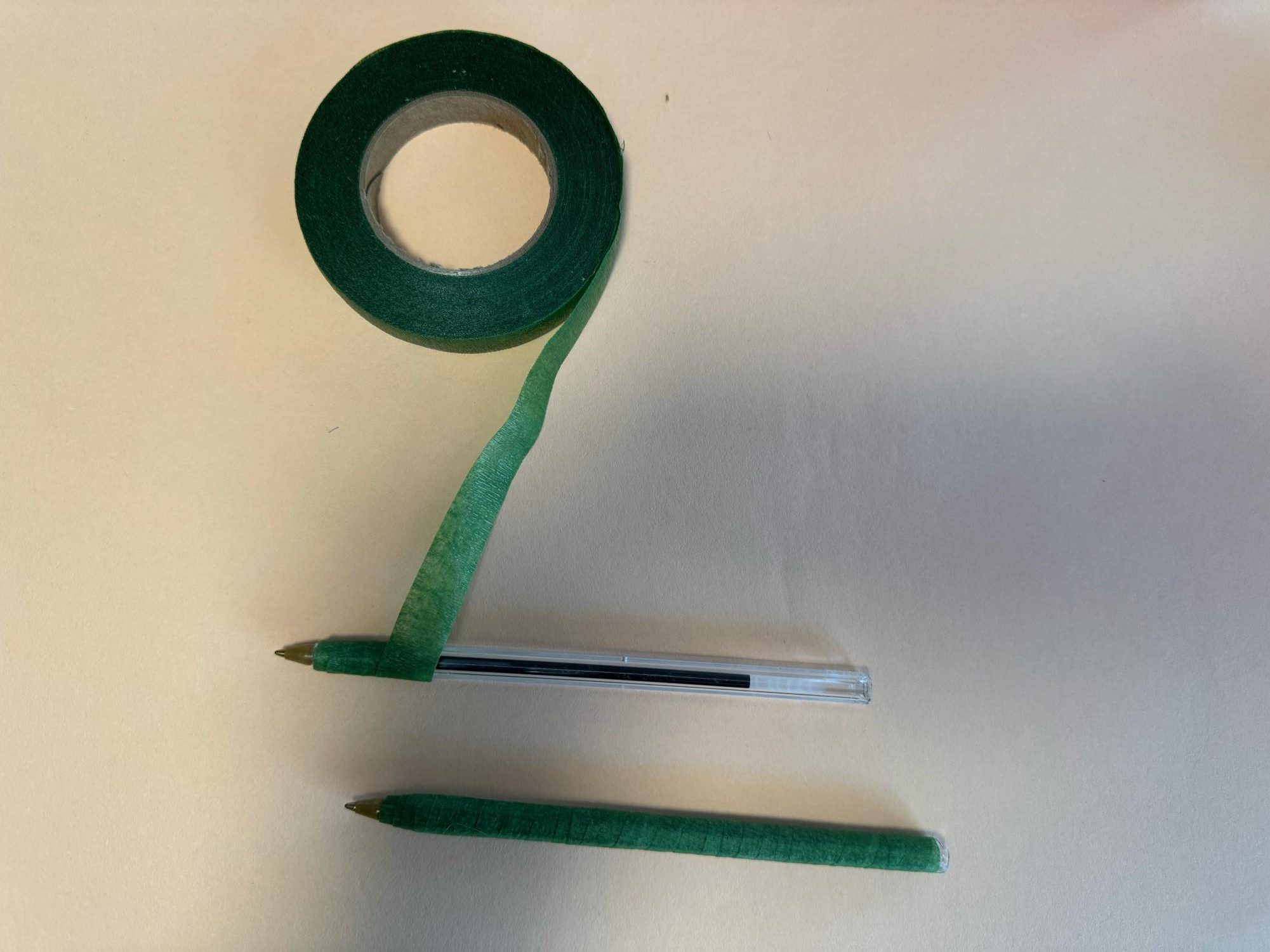 Step 2: wrap the green tape around the pen.