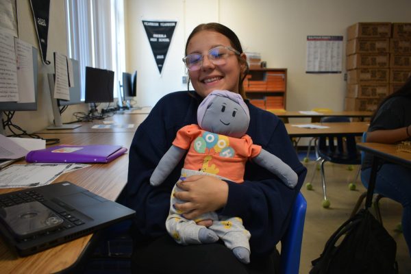 One of the students from Mrs. Gentrys Anatomy class with her flour baby.