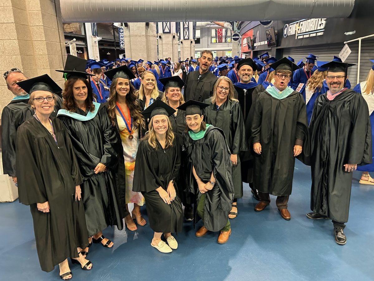 Faculty and staff members celebrate with a group photo. on May 17th.