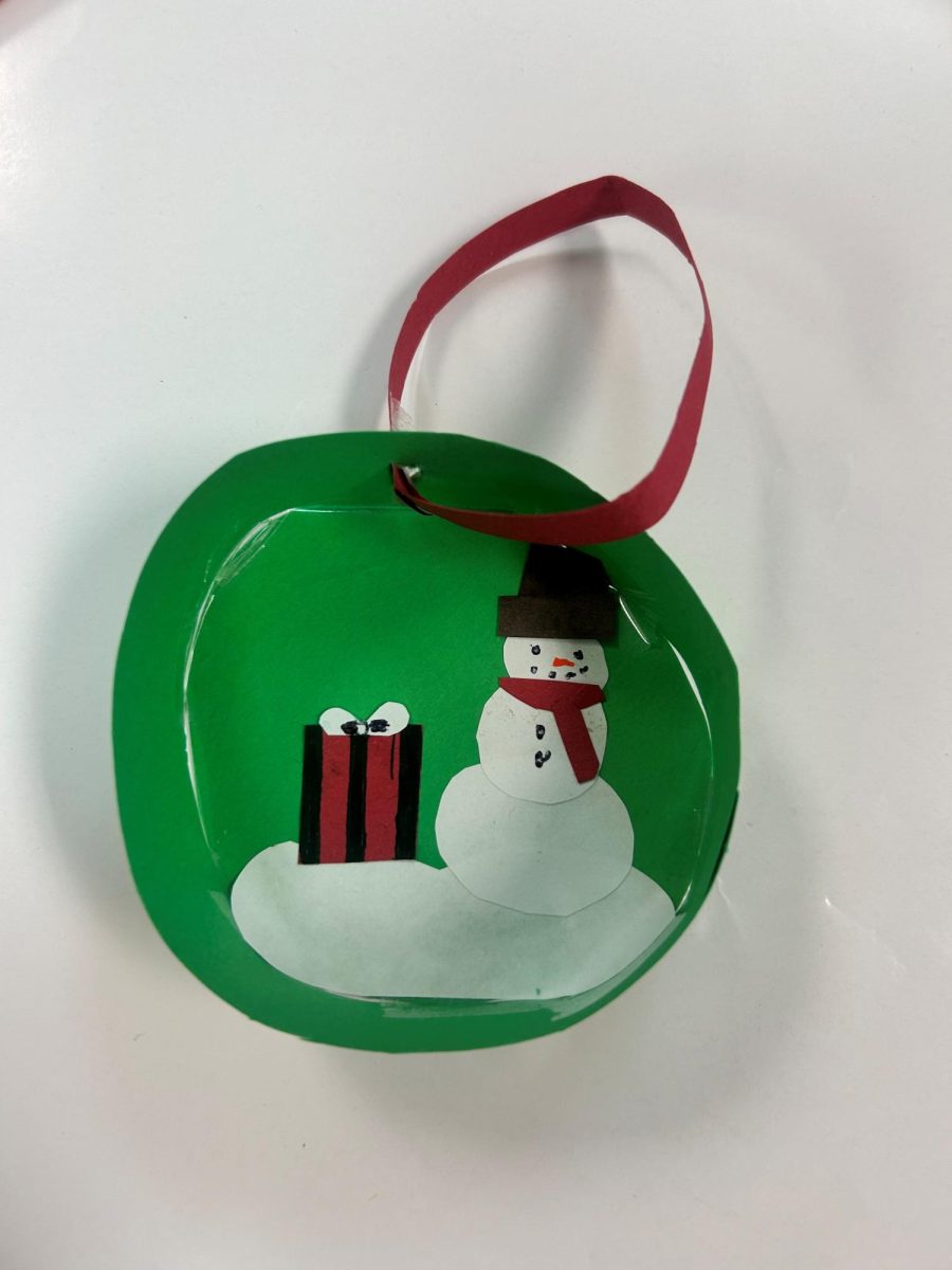 Step six - Put a whole in the top of the ornament and tie a string to it so that you can hang it from the tree!