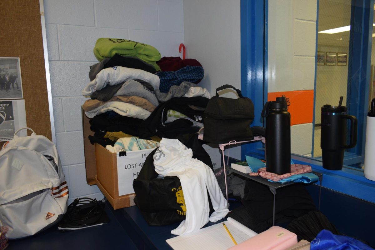 Clothes, including sweatshirts, crewnecks, and heels from Hoco are waiting for their owners to pick them up in student services.