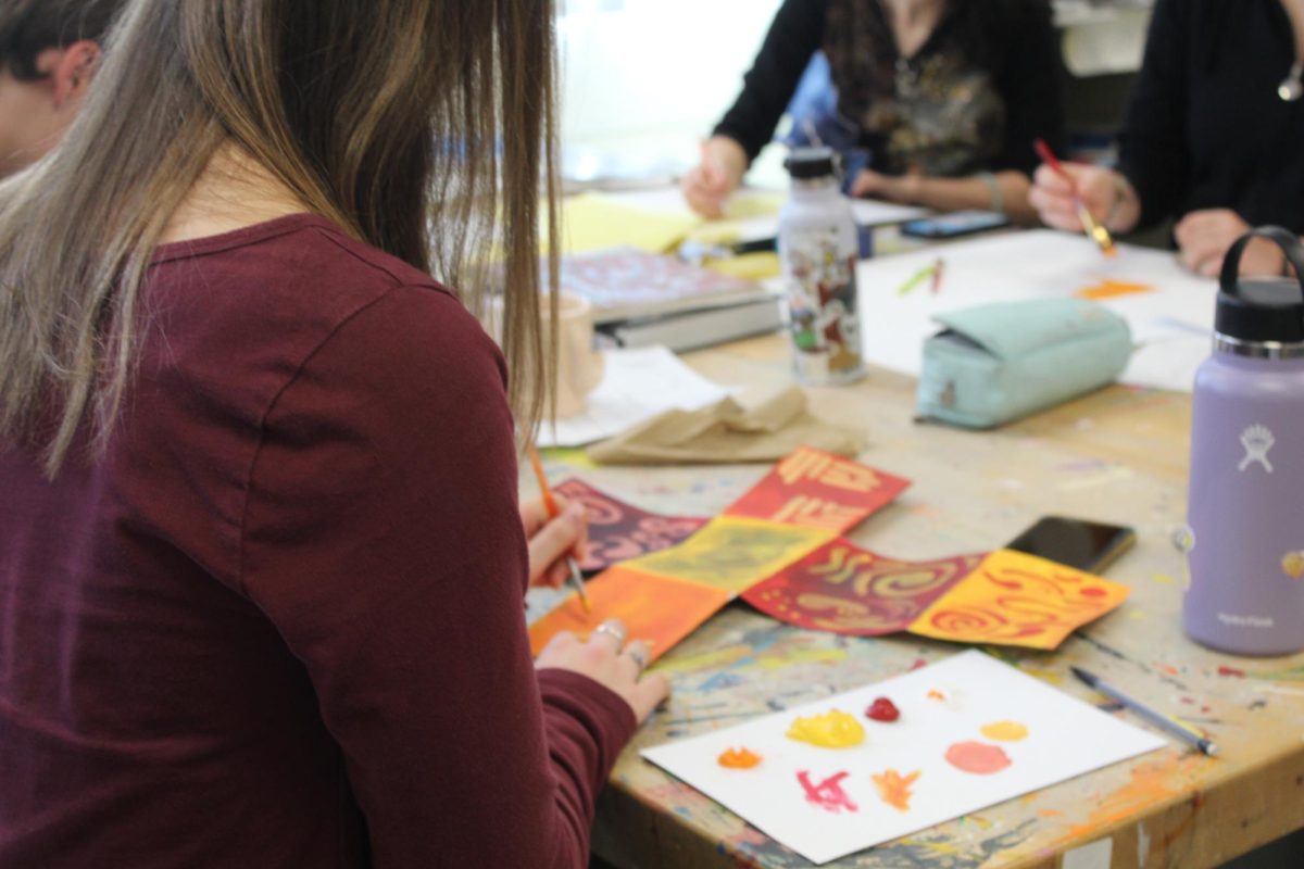 Students work on their clay art.