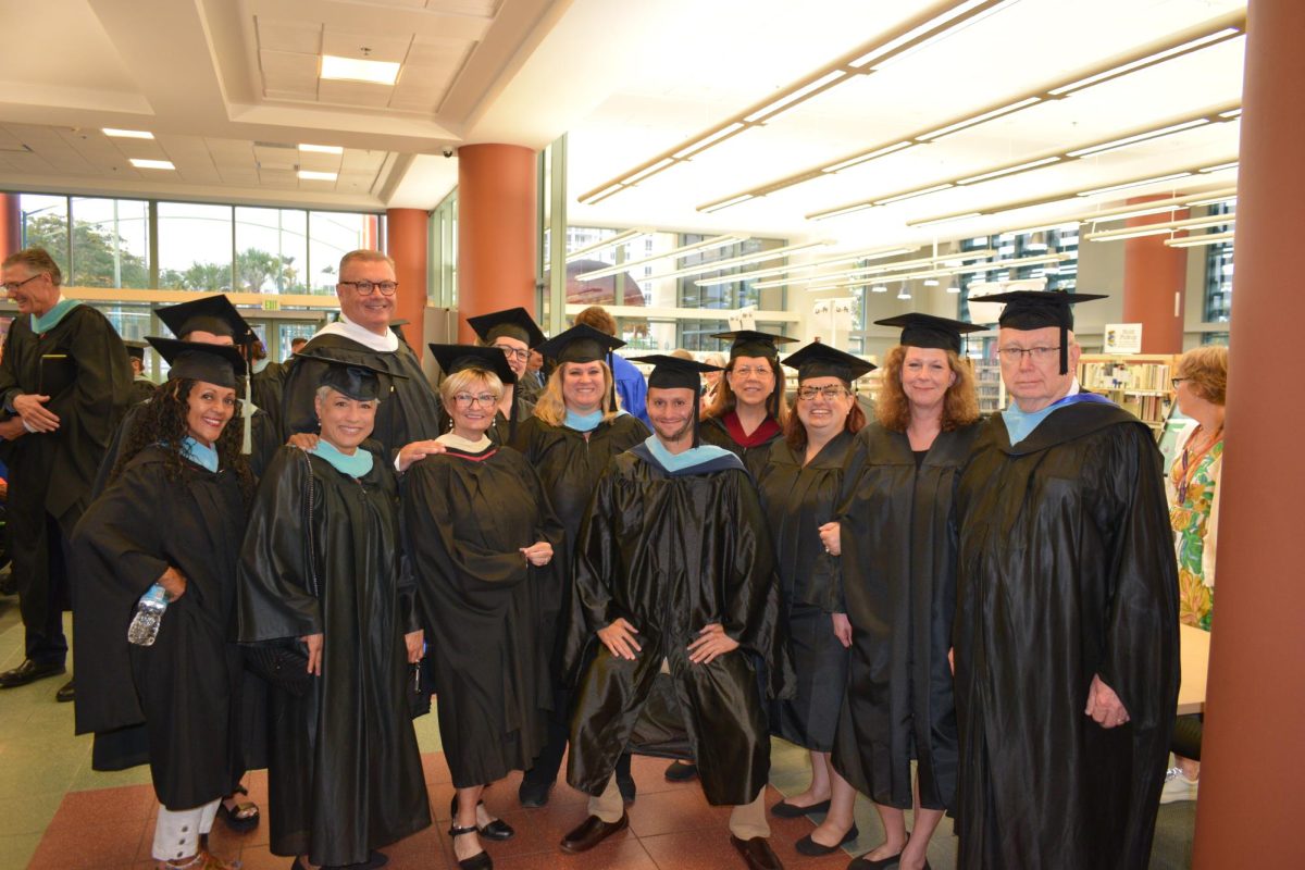 (7:10 a.m.) Faculty and staff members also enjoyed the day by taking pictures and chatting with seniors before graduation.